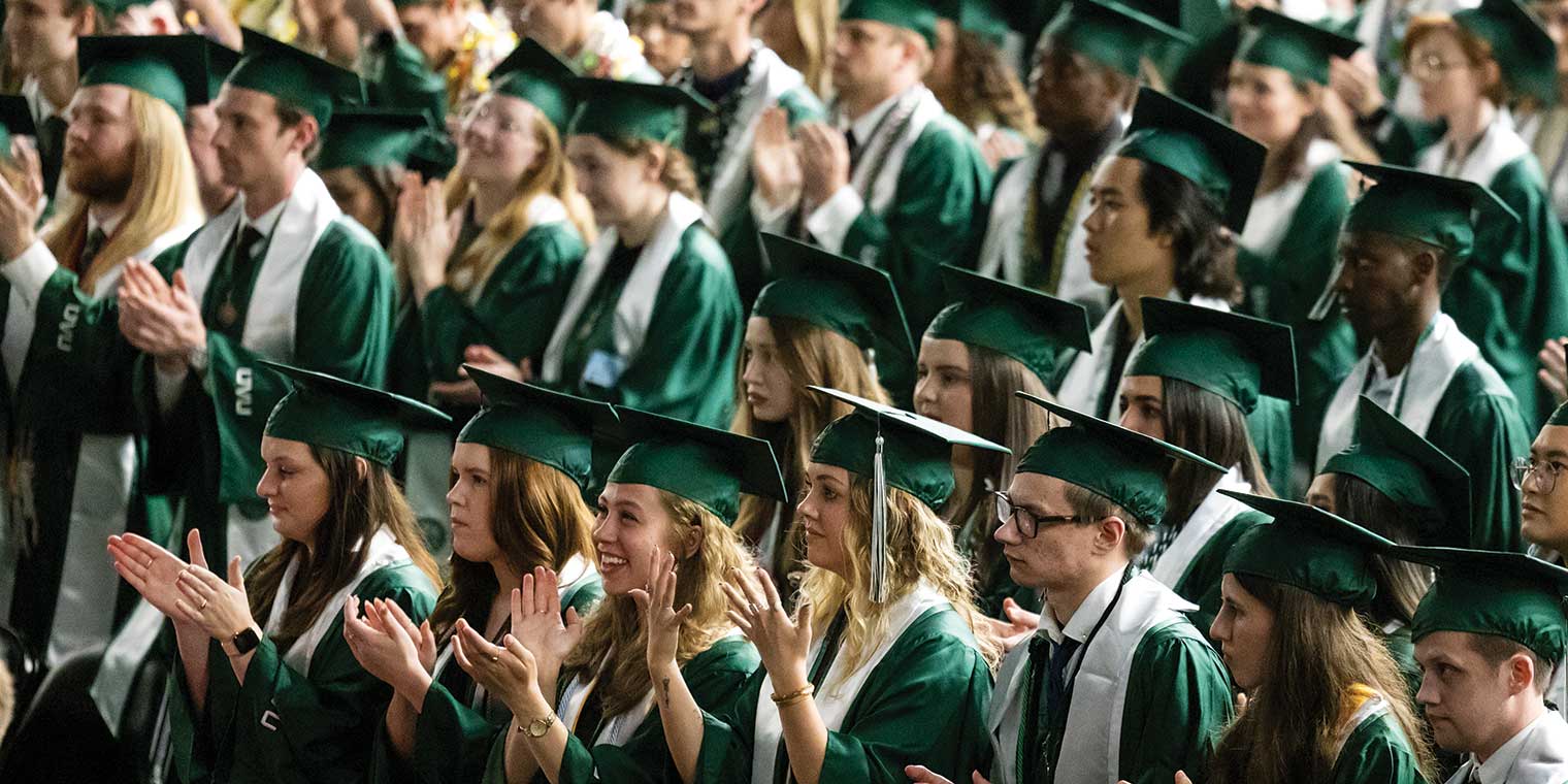 Crowd photo of students graduating at UVU’s 2024 commencement ceremony. 