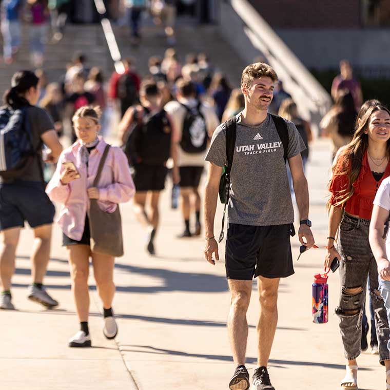 Students walk around outside the library on the first day.