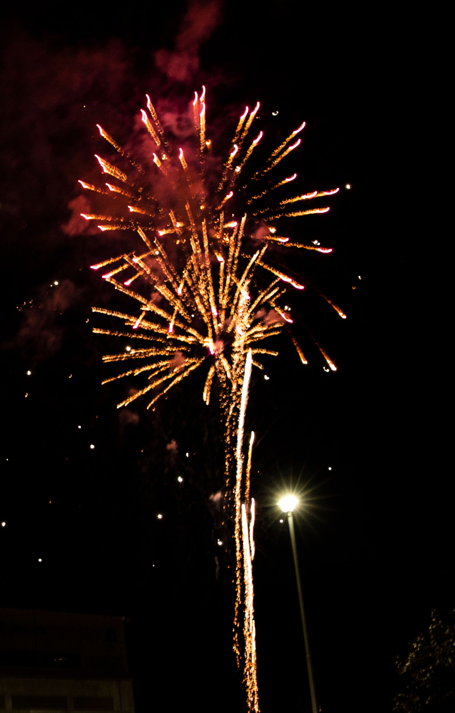 Fireworks explode in the night sky at the Lighting of the UVU celebration