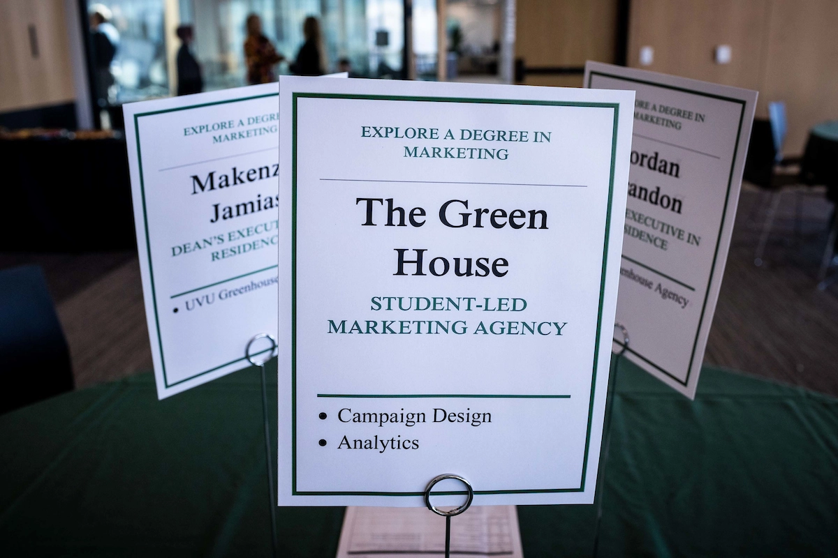 Table pace setting sign advertising 'The Green House'.