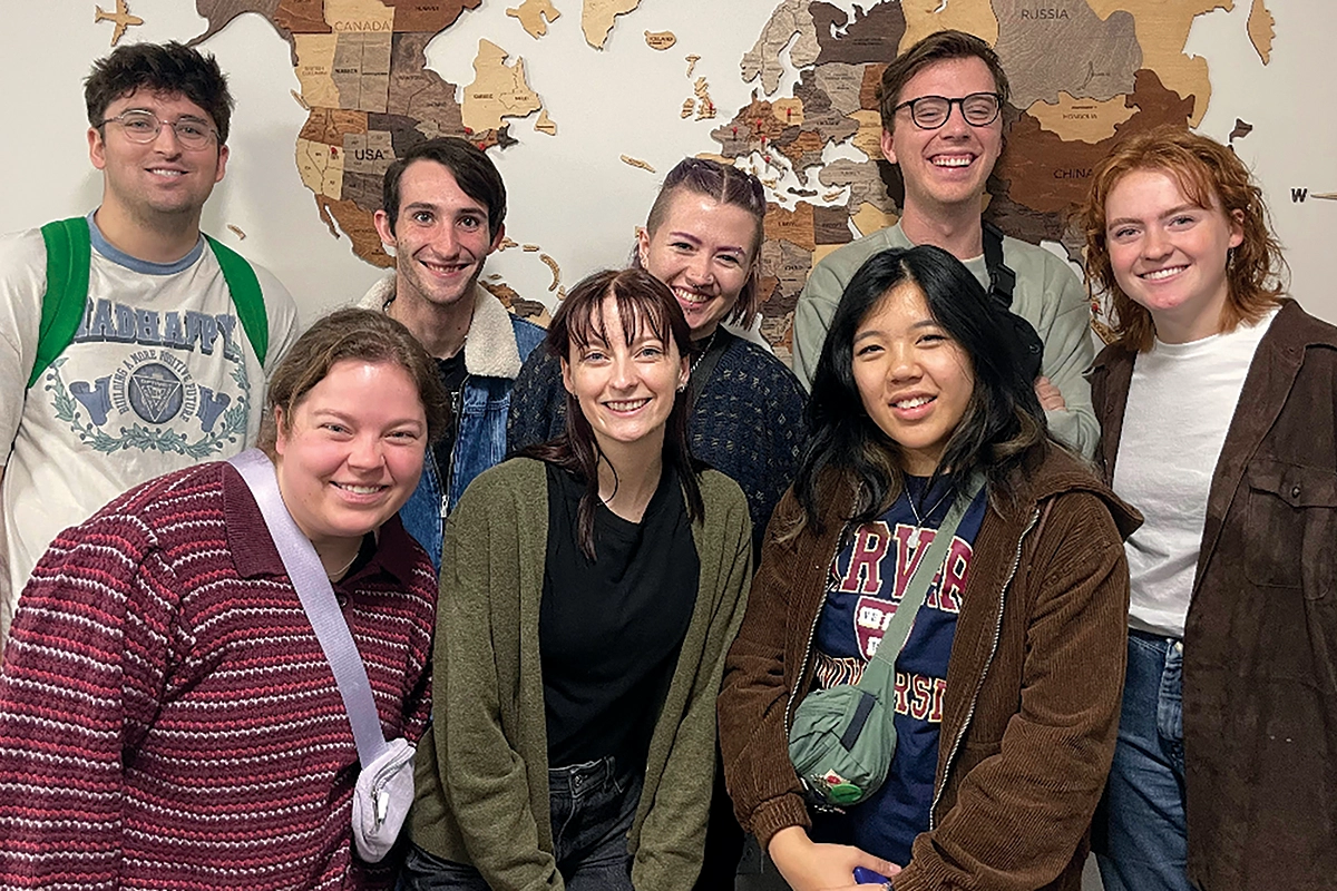 Students from UVU’s Product Team smile in front of a map of the United States during an expedition to Boston, Massachusetts. 